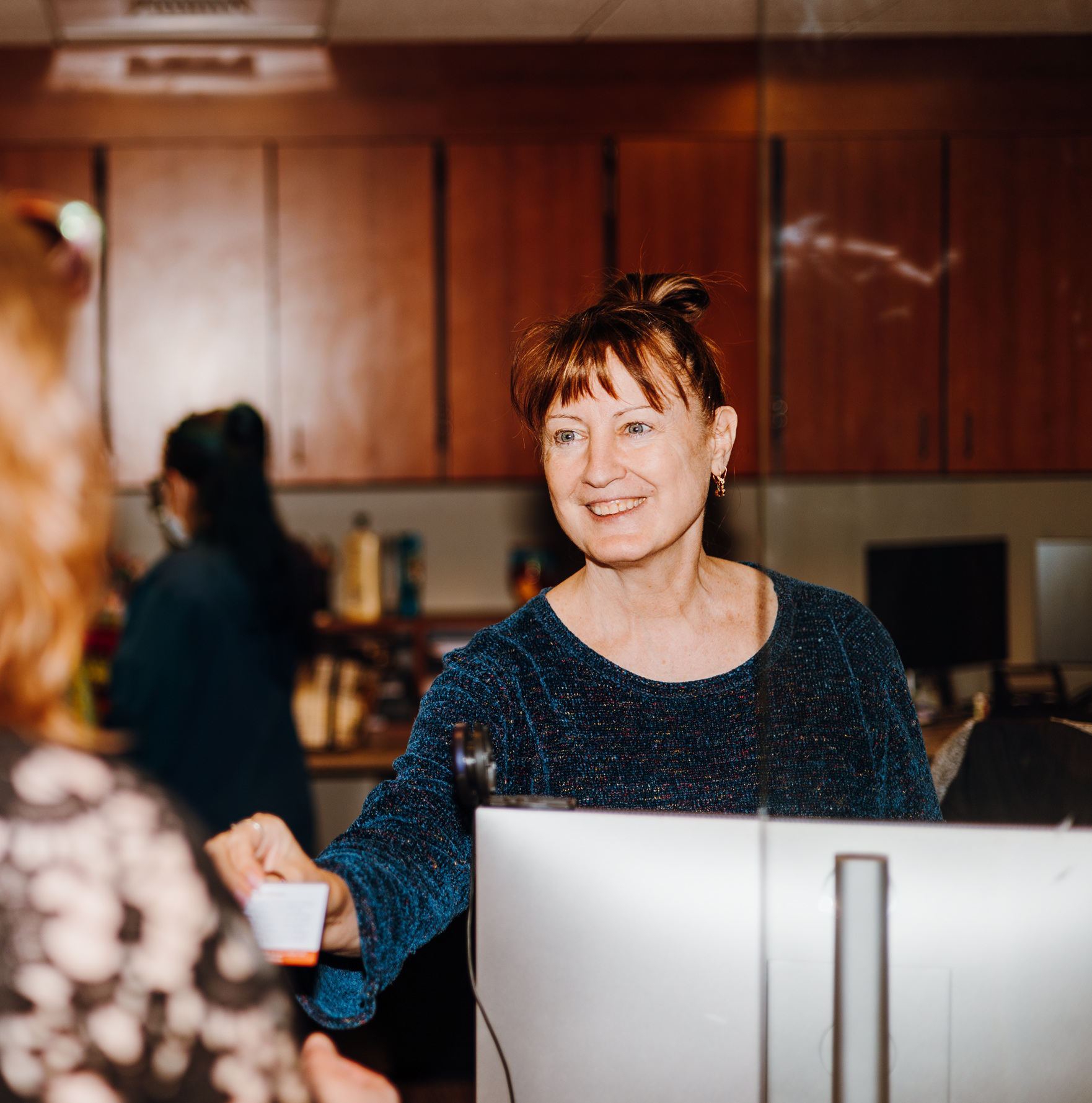 Woman using phone for telehealth conferencing